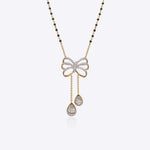 14K gold mangalsutra with Polki detailing and onyx accents