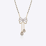14K gold mangalsutra with Polki detailing and onyx accents