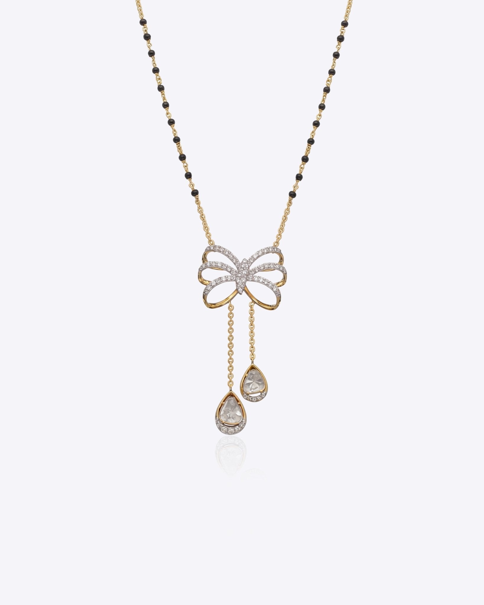 14K gold mangalsutra with Polki detailing and onyx accents