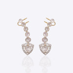14K gold curved drop earrings with round Polki detailing.
