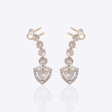 14K gold curved drop earrings with round Polki detailing.