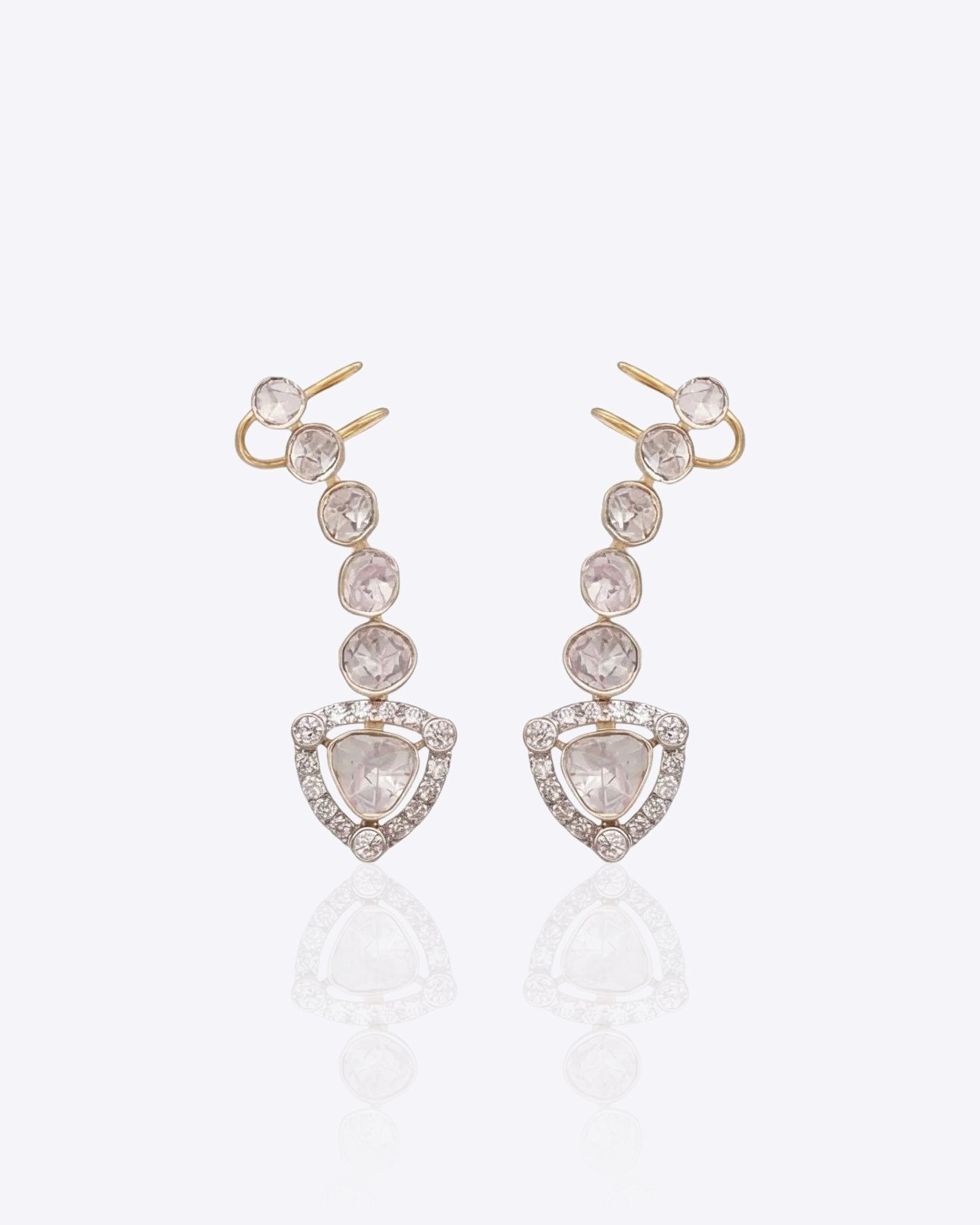 14K gold curved drop earrings with round Polki detailing.