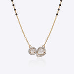 14K gold mangalsutra with round and oval Polki charms