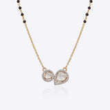 14K gold mangalsutra with round and oval Polki charms