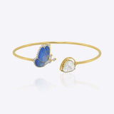 14kt gold bangle with a butterfly-inspired design and delicate Polki accents