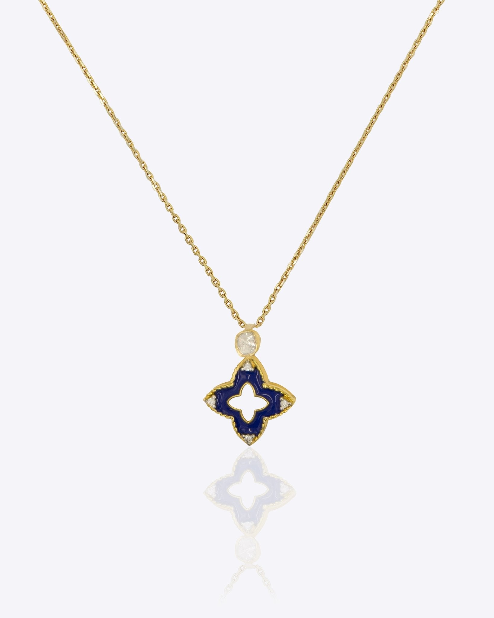 9kt gold pendant with deep blue enamel in a delicate charm shape