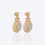 14K gold drop earrings with carved aquamarine centers and Polki diamond accents.