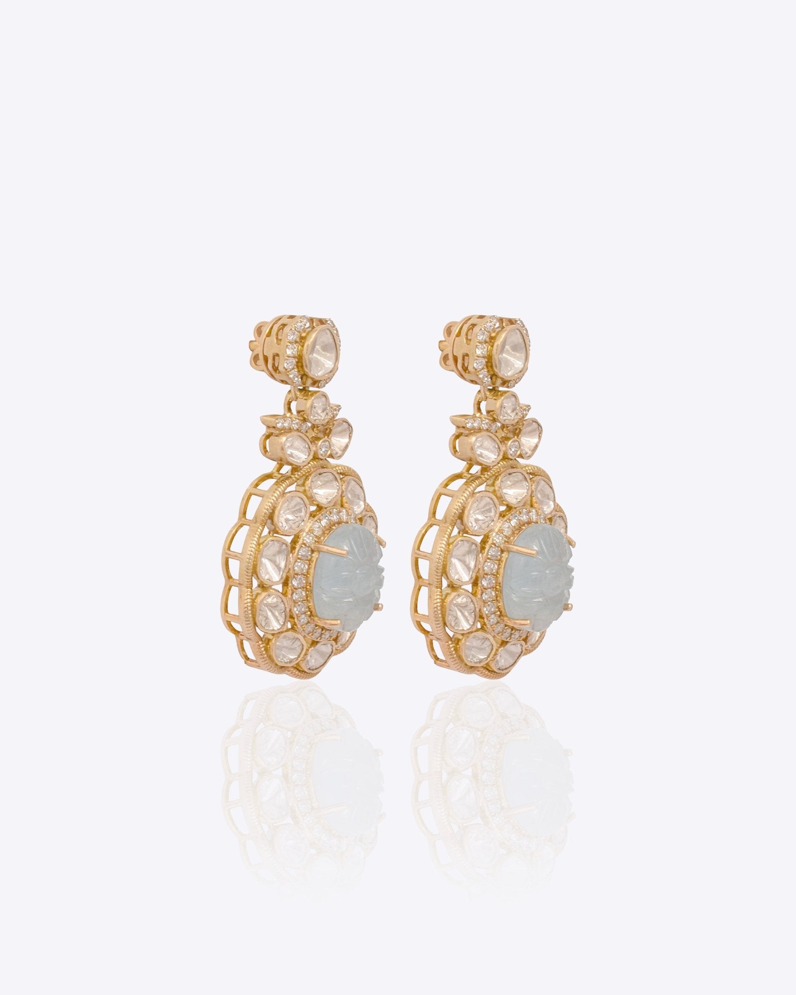 14K gold drop earrings with carved aquamarine centers and Polki diamond accents.