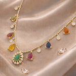 18k gold Navratna Grace necklace with colourful Navratna stones and drop detailing.