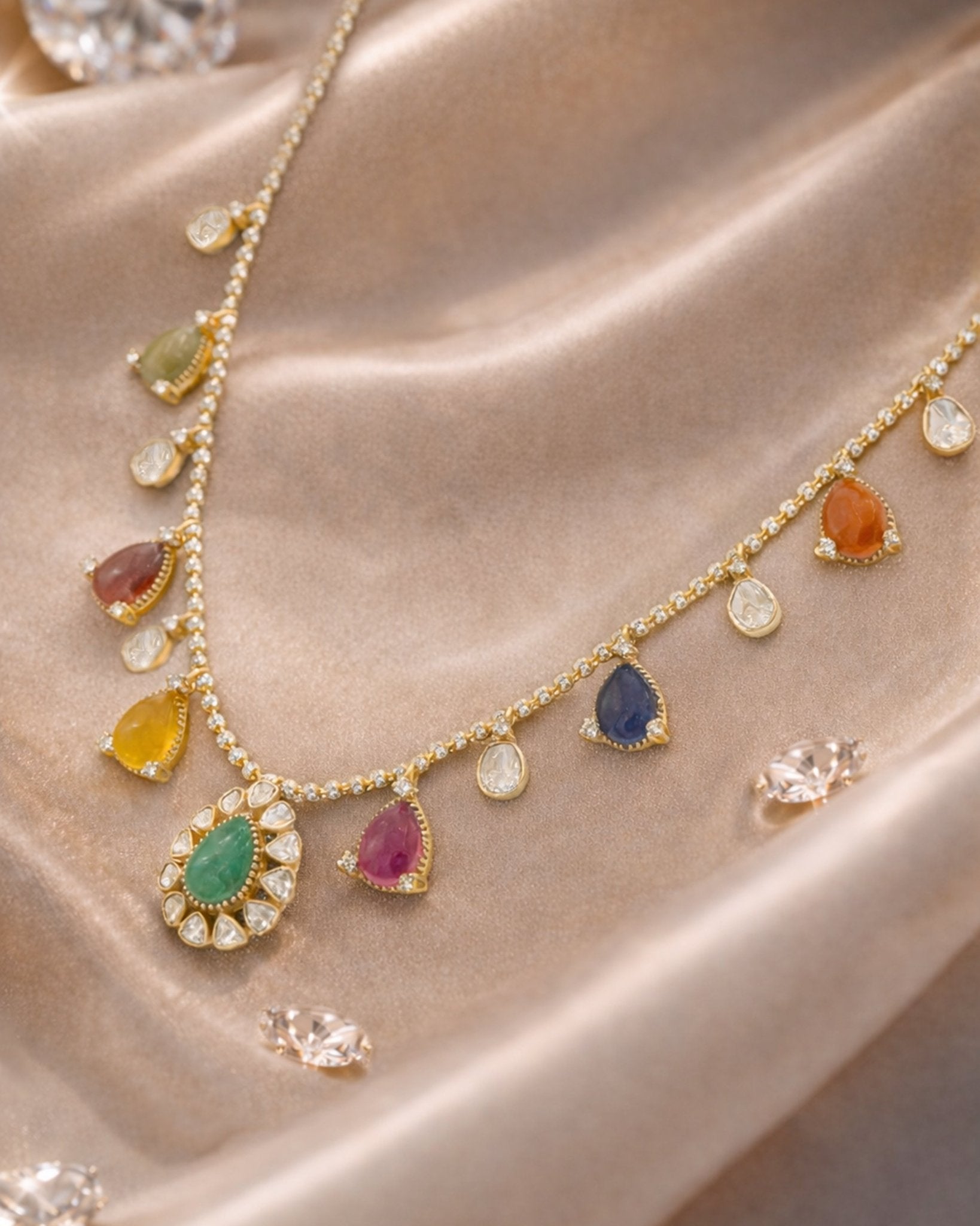 18k gold Navratna Grace necklace with colourful Navratna stones and drop detailing.
