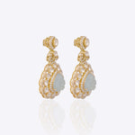 14K gold drop earrings with carved aquamarine petals and fine Polki diamond accents.