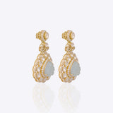 14K gold drop earrings with carved aquamarine petals and fine Polki diamond accents.