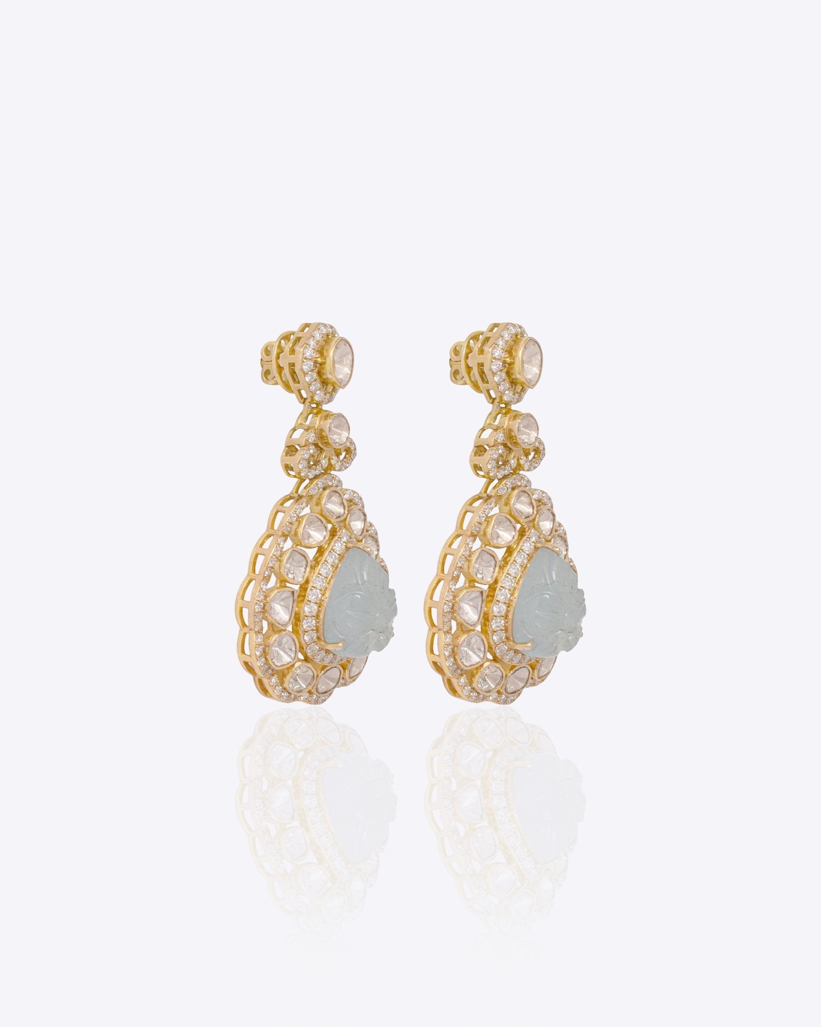 14K gold drop earrings with carved aquamarine petals and fine Polki diamond accents.
