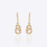 14K gold Nova Hexa earrings with a hexagonal motif, Polki, and diamonds.