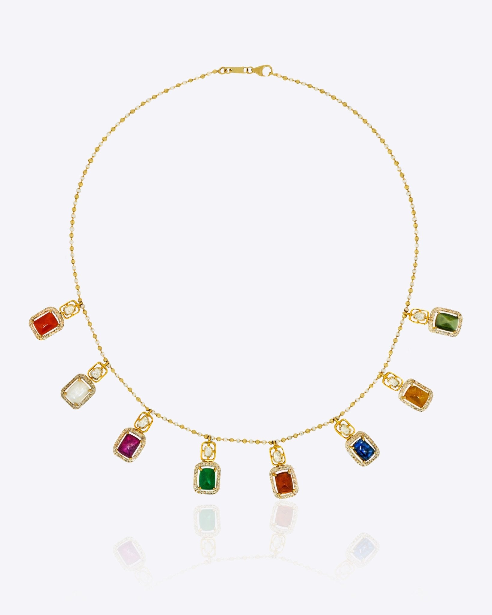 Heritage Hue Necklace in 14K gold with nine rectangular gemstones and Polki diamonds.