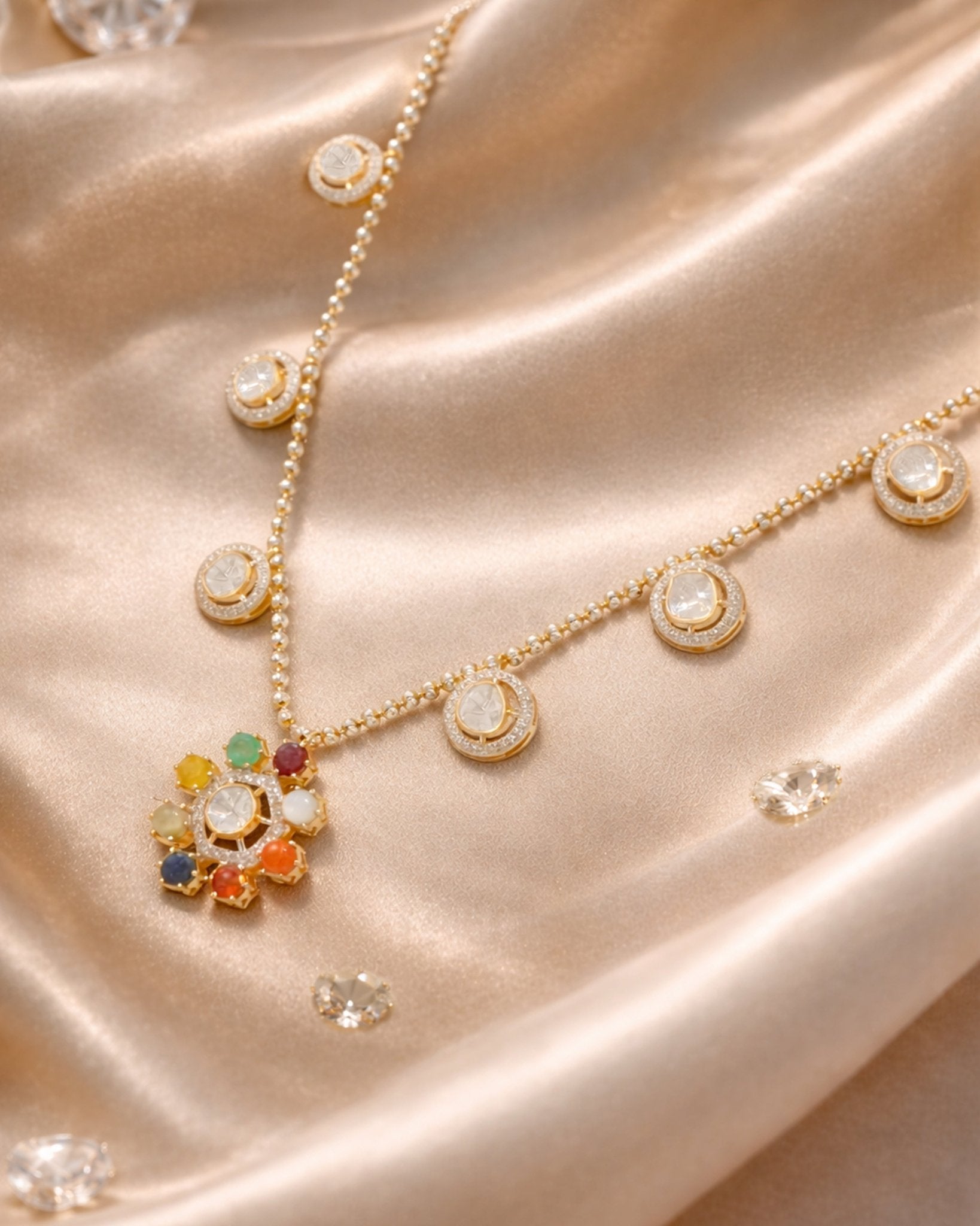 18K gold Navratna Bloom necklace with a radiant bloom and delicate drops.