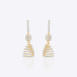 14k gold spiral earrings with Polki diamonds in a sculptural helix design.