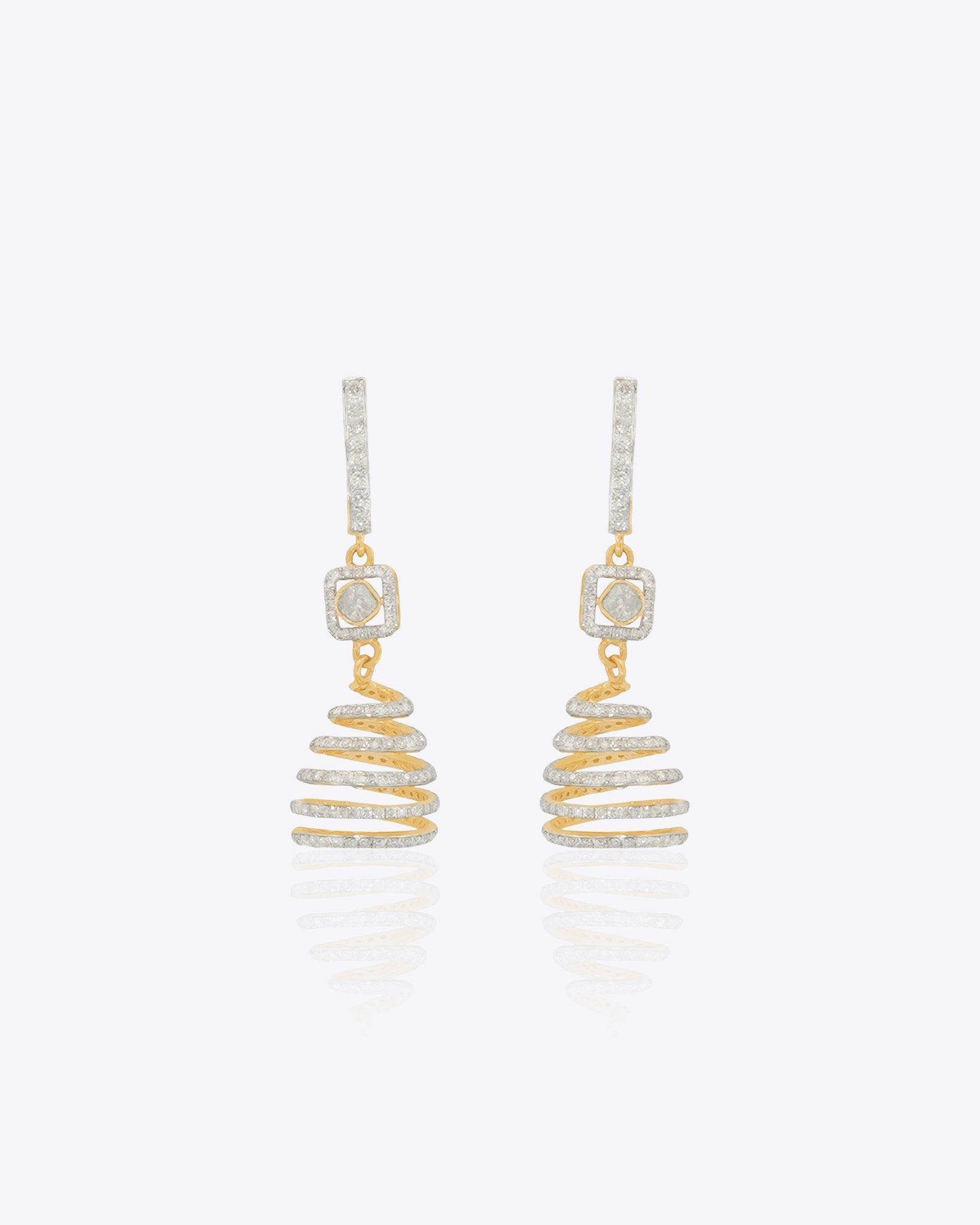 14k gold spiral earrings with Polki diamonds in a sculptural helix design.