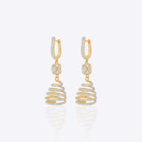 14k gold spiral earrings with Polki diamonds in a sculptural helix design.