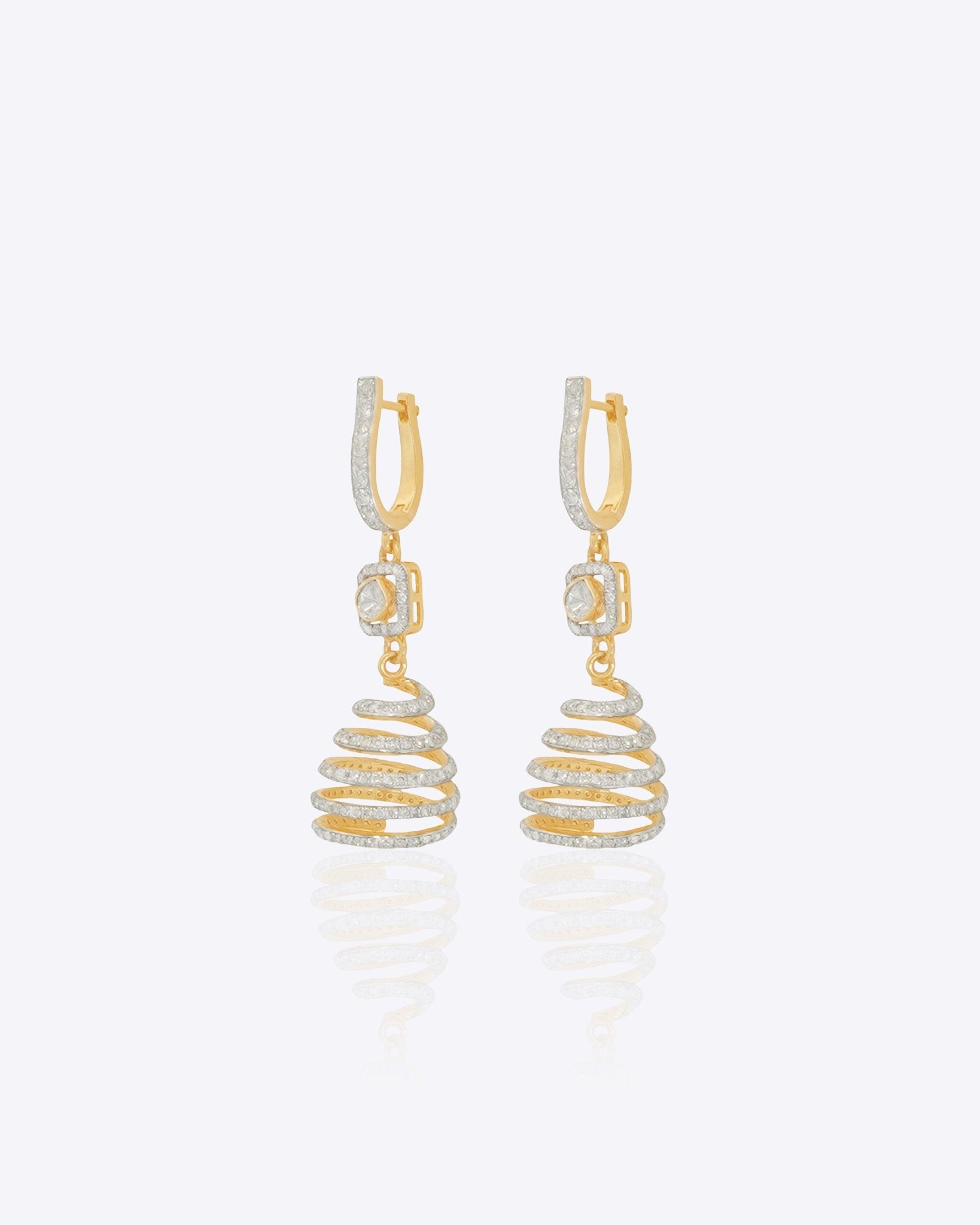 14k gold spiral earrings with Polki diamonds in a sculptural helix design.