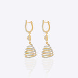 14k gold spiral earrings with Polki diamonds in a sculptural helix design.