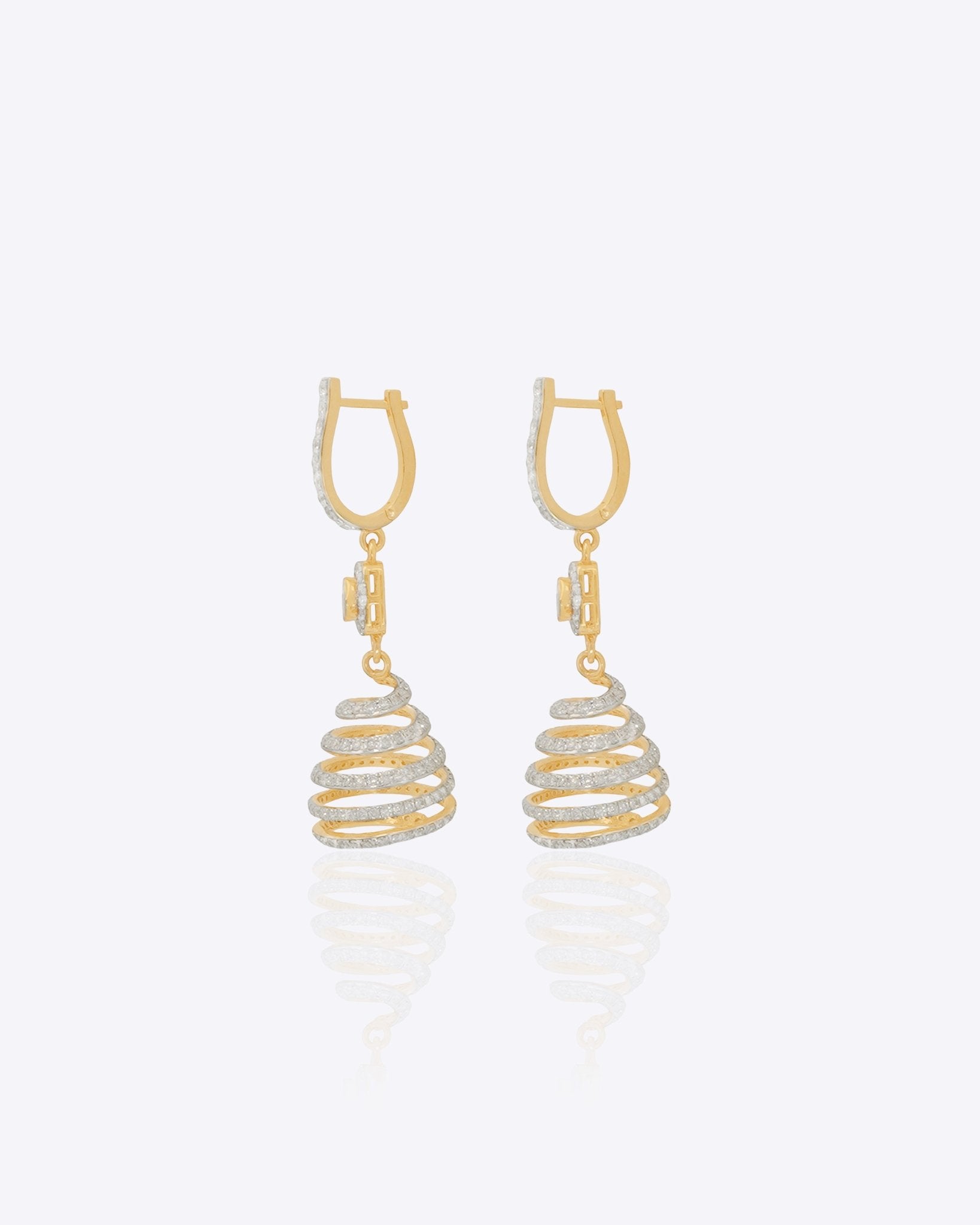 14k gold spiral earrings with Polki diamonds in a sculptural helix design.