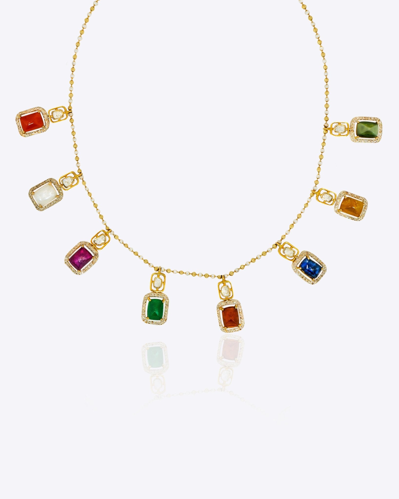 Heritage Hue Necklace in 14K gold with nine rectangular gemstones and Polki diamonds.