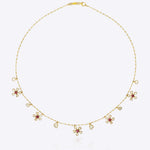 Floral Whisper Necklace in 14K gold with ruby-centred florals and Polki drops.