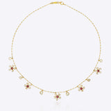Floral Whisper Necklace in 14K gold with ruby-centred florals and Polki drops.