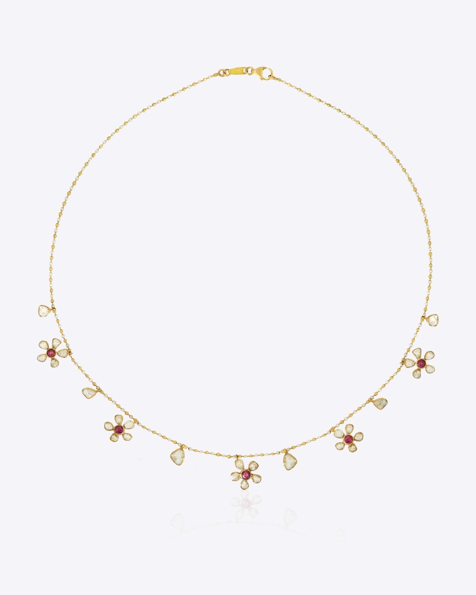 Floral Whisper Necklace in 14K gold with ruby-centred florals and Polki drops.