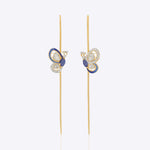 14k gold Mystic Wing earpins with Polki, diamonds, and tanzanite in a butterfly-wing design.