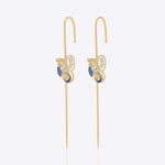 14k gold Mystic Wing earpins with Polki, diamonds, and tanzanite in a butterfly-wing design.