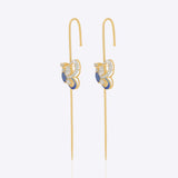 14k gold Mystic Wing earpins with Polki, diamonds, and tanzanite in a butterfly-wing design.