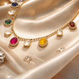 18K gold necklace with a graceful rhythmic design and a soft rosy tone.