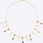 14k gold Navratna Symphony necklace with Polki diamonds and Navratna gems.