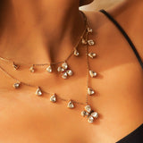 14k gold Papillon Dream Necklace with double-layered chain and Polki droplets.