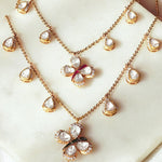 14k gold Papillon Dream Necklace with double-layered chain and Polki droplets.
