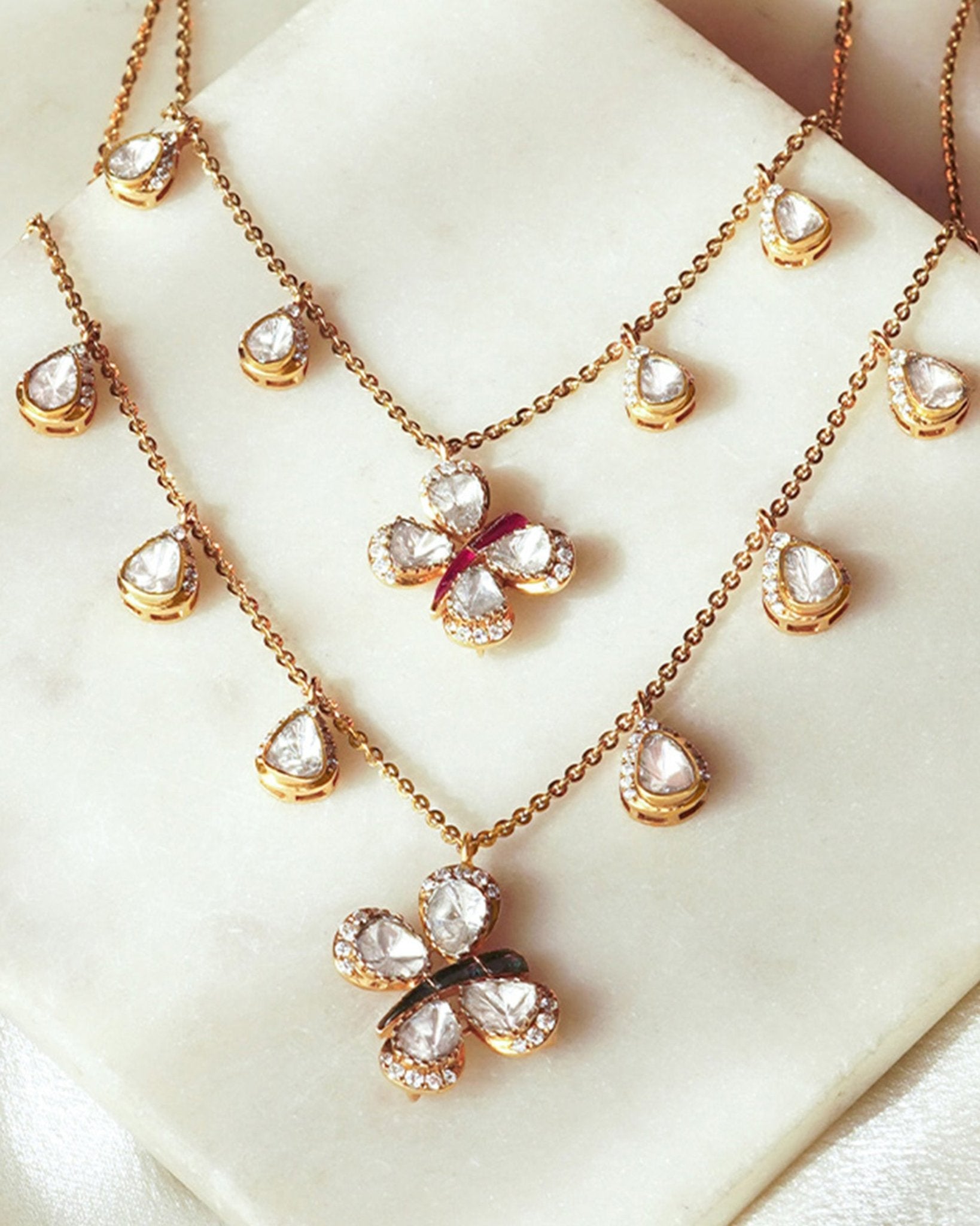 14k gold Papillon Dream Necklace with double-layered chain and Polki droplets.