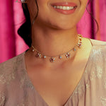 Floral Whisper Necklace in 14K gold with ruby-centred florals and Polki drops.