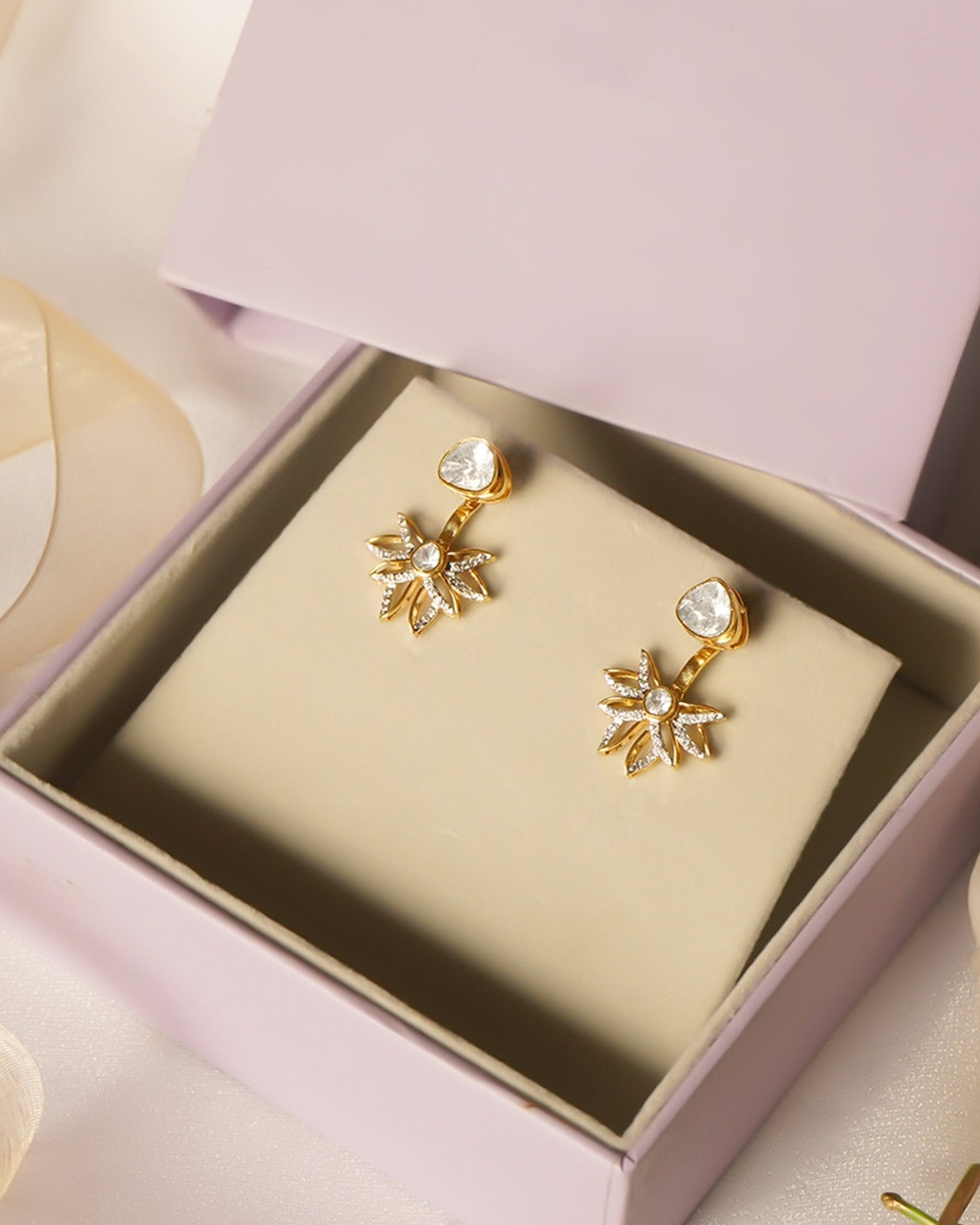 14K gold starburst-design jacket earrings set with Polki diamonds.