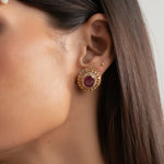 14k gold stud earrings with ruby center and uncut diamond halo