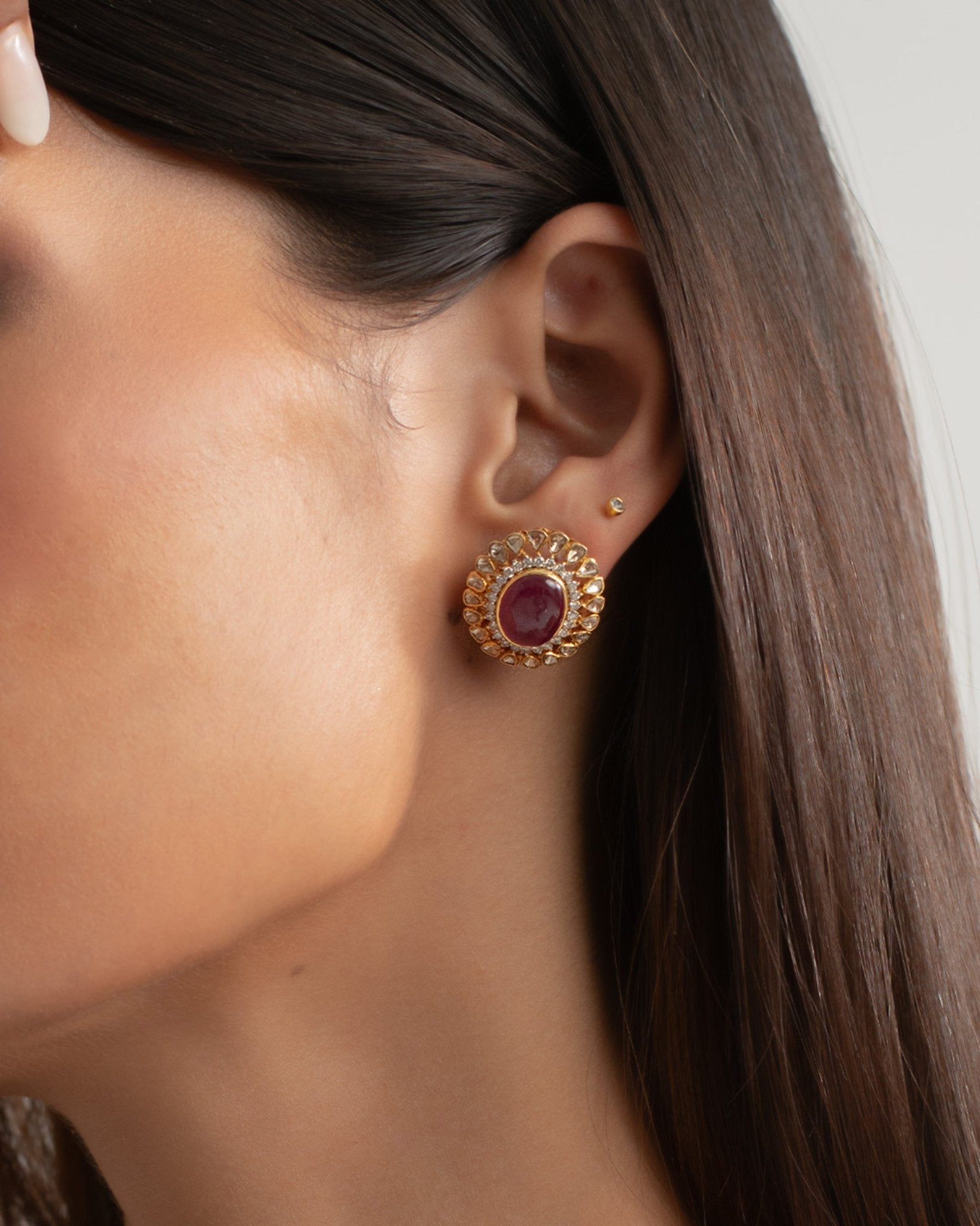 14k gold stud earrings with ruby center and uncut diamond halo