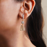 14k gold spiral earrings with Polki diamonds in a sculptural helix design.