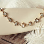 Close-up of Regal Enamel necklace featuring deep hues and traditional diamond setting