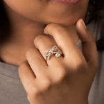 14k gold ring with a sleek, minimalist bow silhouette.