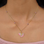 9K gold pendant with a blush petal silhouette and soft pink accents.