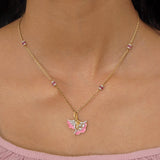 9K gold pendant with a blush petal silhouette and soft pink accents.