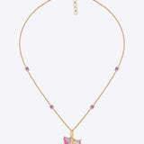 9K gold pendant with a blush petal silhouette and soft pink accents.