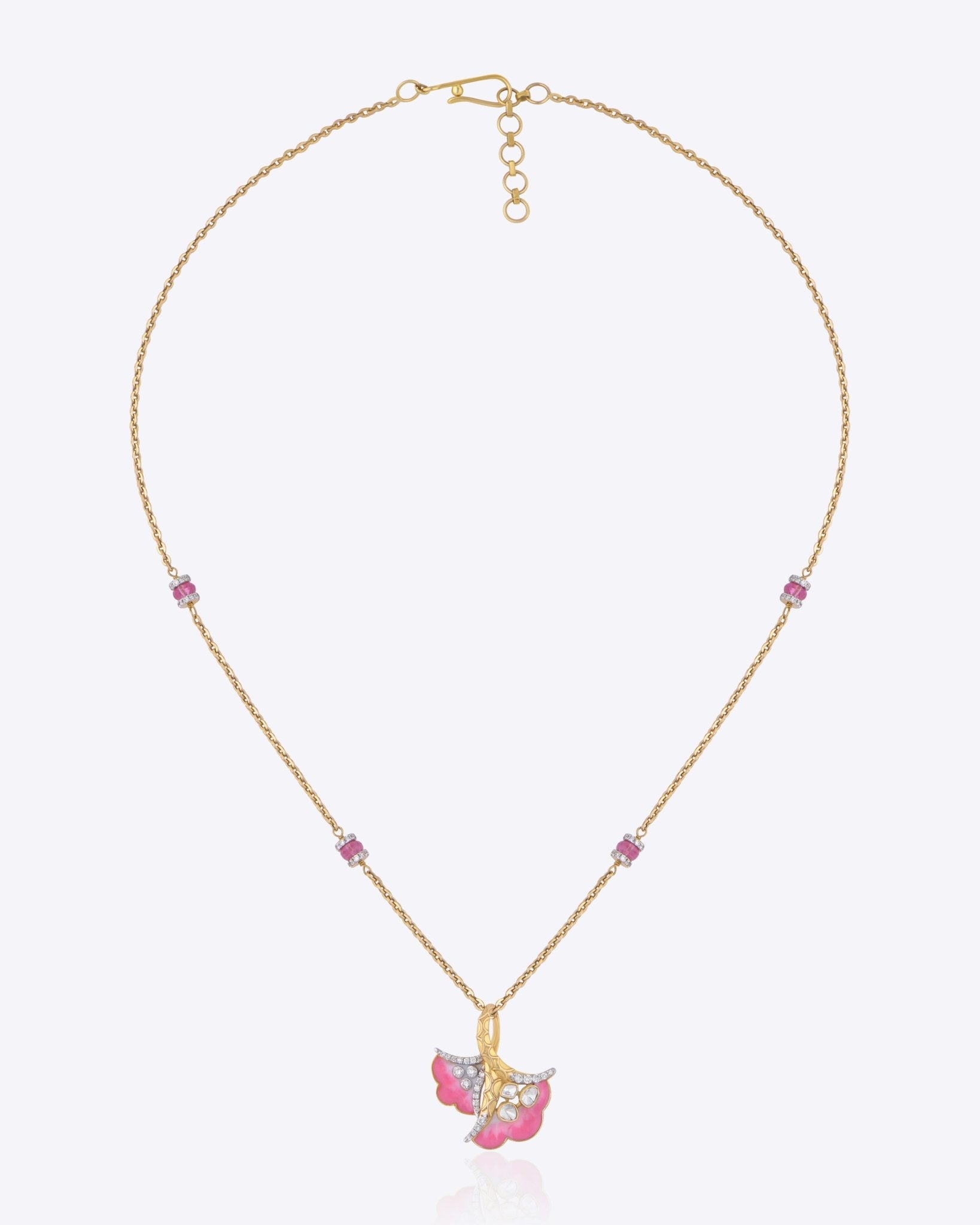 9K gold pendant with a blush petal silhouette and soft pink accents.