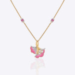 9K gold pendant with a blush petal silhouette and soft pink accents.
